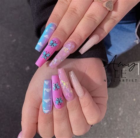 Pastel Pink Nails With Butterflies It may be a print on your clothes