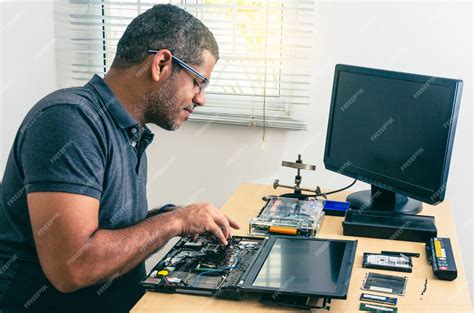 Computer Technician Fixing Laptop