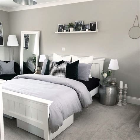 Grey And White Bedroom With Wood Furniture