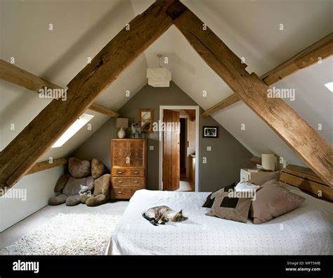 converted attic bedroom ideas with exposed beams