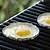 cooking eggs on a grill
