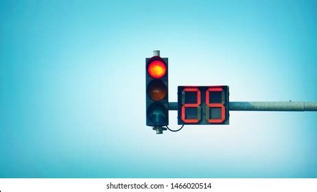 Red traffic light with a seconds countdown timer. Modern LED traffic light isolated on white
