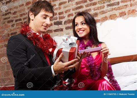 Couple exchanging gifts