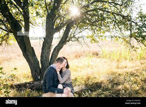 Couple Hugging Under a Tree