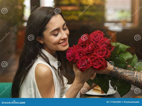 Couple Receiving a Dozen Roses