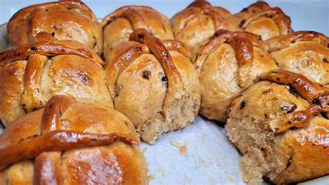 Hot cross buns are lightly spiced, sweet yeast rolls with