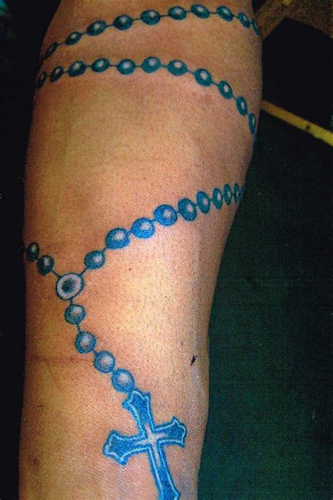 cross and rosary beads tattoo