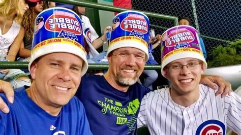 cubs fan wears bucket