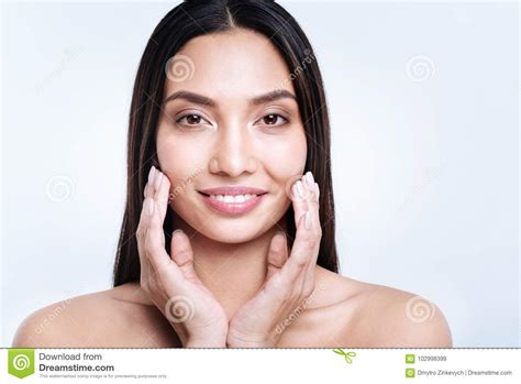 cupping your face with both hands meaning