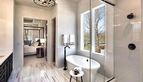 a sleek space with furnishings pared down the master bathroom invites