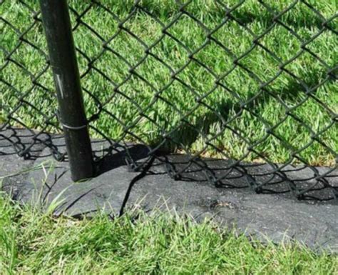 Cutting Grass Under Fences