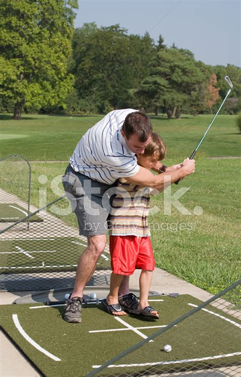 dad and son golf