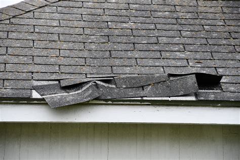 damaged asphalt shingles