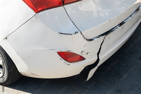 Damaged bumper on car