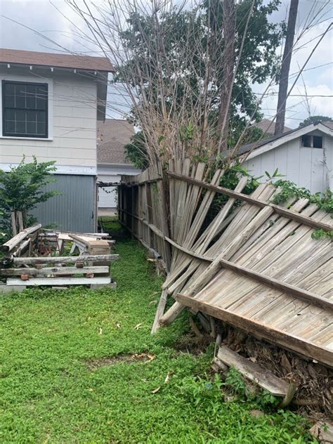 Damaged fence with storm damage