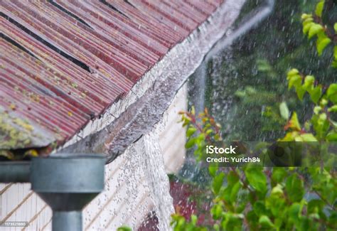 damaged gutter overflowing with water
