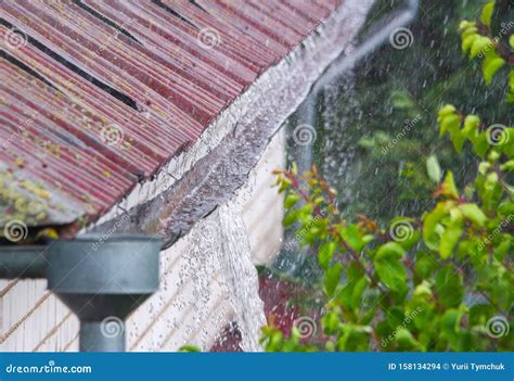 Damaged gutter with water overflowing