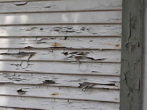 Damaged siding on a home in Madison, WI