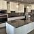 dark grey countertops with white cabinets