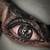 dark realism eye tattoo with color