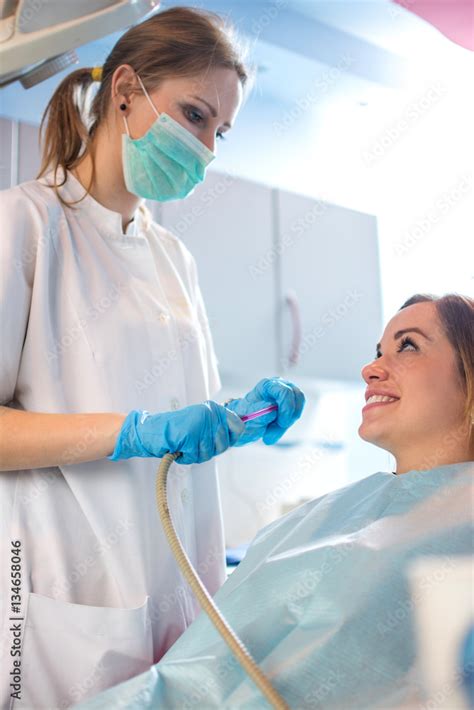 Dental Assistant Suctioning