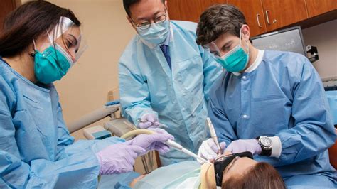 dental implants at a dental school cost