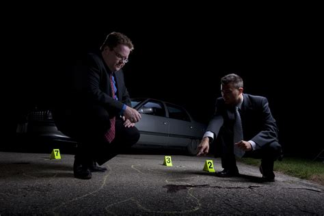 detectives at a crime scene