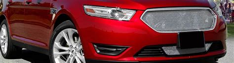A collection of different 2014 Ford Taurus grilles showcasing various styles and finishes