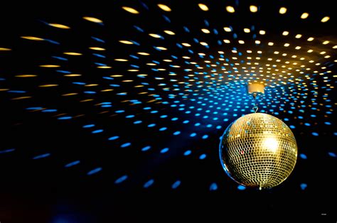 Get Your Groove On with a Sparkling Disco Ball Background: Add Pizzazz to Your Party Decor