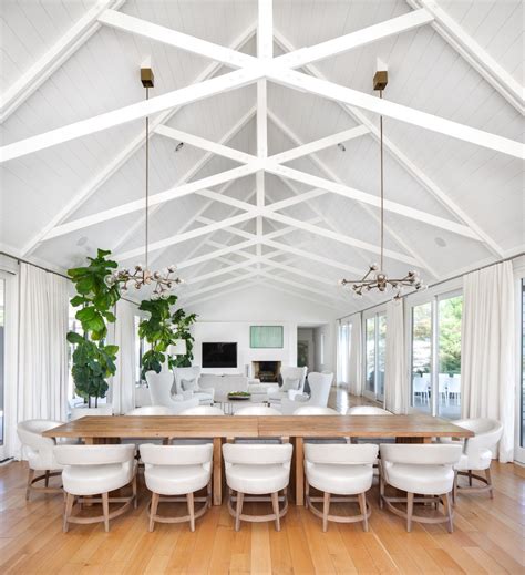 High ceilings create an airy, open feel in this living area, and soft, neutral… Farm house