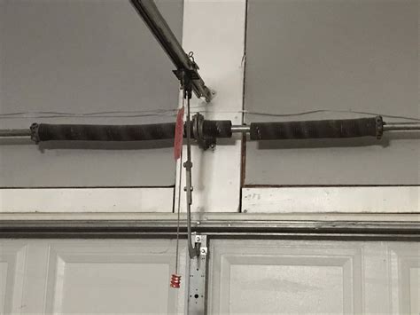 does garage door torsion spring impact garage door opener