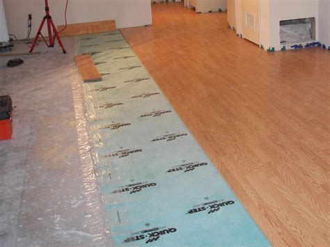 does glue go on to of underlayment wood floor installation