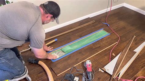 does gluing a laminate floor replacement board hold up