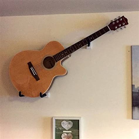does hanging a guitar on the wall damage it