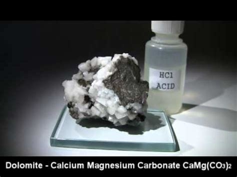 Does dolomite react with hcl?