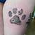 dog paw print flower tattoo