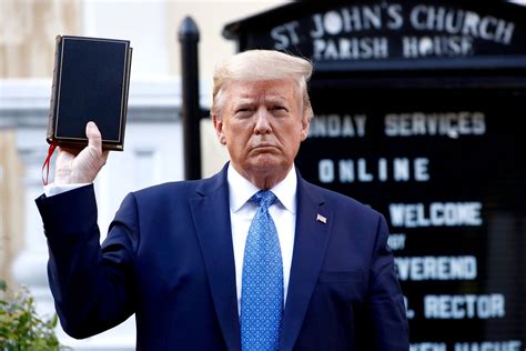 donald trump holding the bible upside down