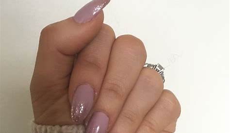 Dusky pink almond shaped gel nails with rose gold ombré glitter tips