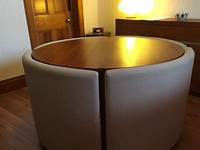 Dwell round glass dining table + 4 faux leather chairs in Wandsworth