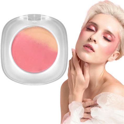 Image of a girl applying blush to her cheeks