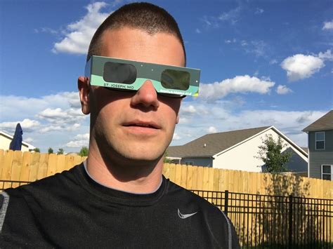 eclipse glasses over glasses