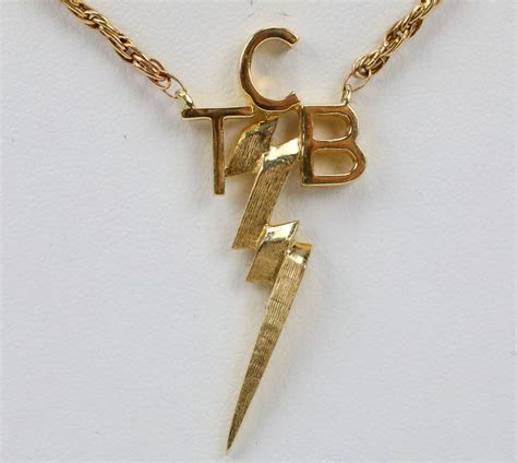 elvis presley necklace tcb