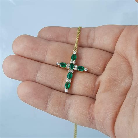 emerald and diamond cross pendant