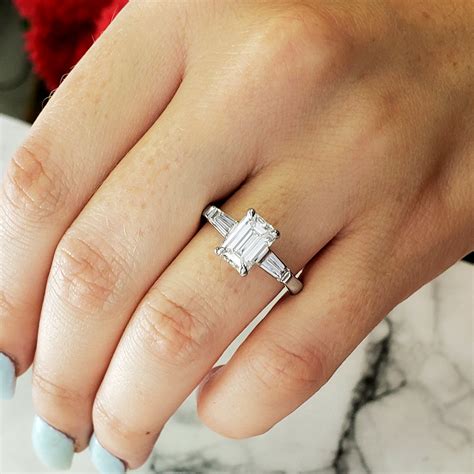 engagement ring with baguettes on side