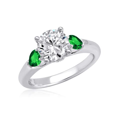 engagement rings with emerald side stones