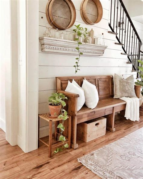 Entry way decorating ideas with a storage bench, decor and hooks