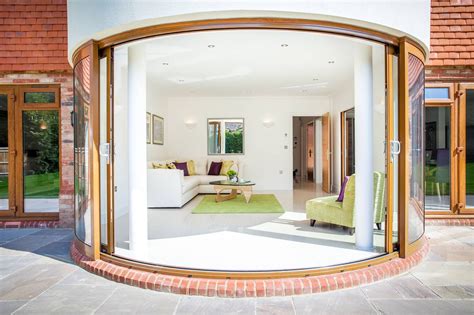 extension to living room with sliding doors and curved ceiling