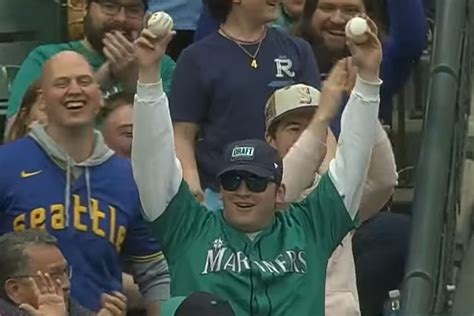 fan catches two foul balls in a row