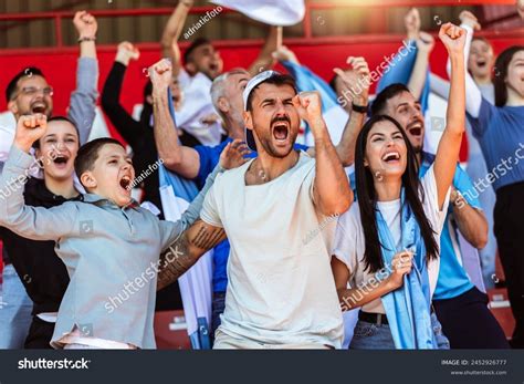 Fans cheering at game