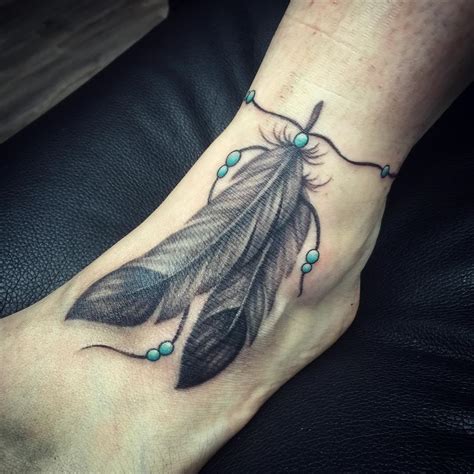 A delicate feather tattoo Feather tattoo black, Feather tattoos, Feather tattoo foot